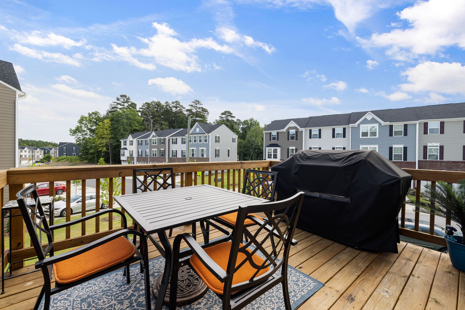 A clean wood deck behind a house